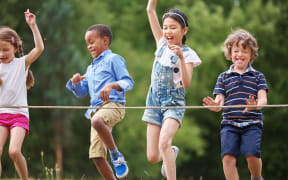 48658696 - A photo of children arriving to the finish line at race at a birthday party