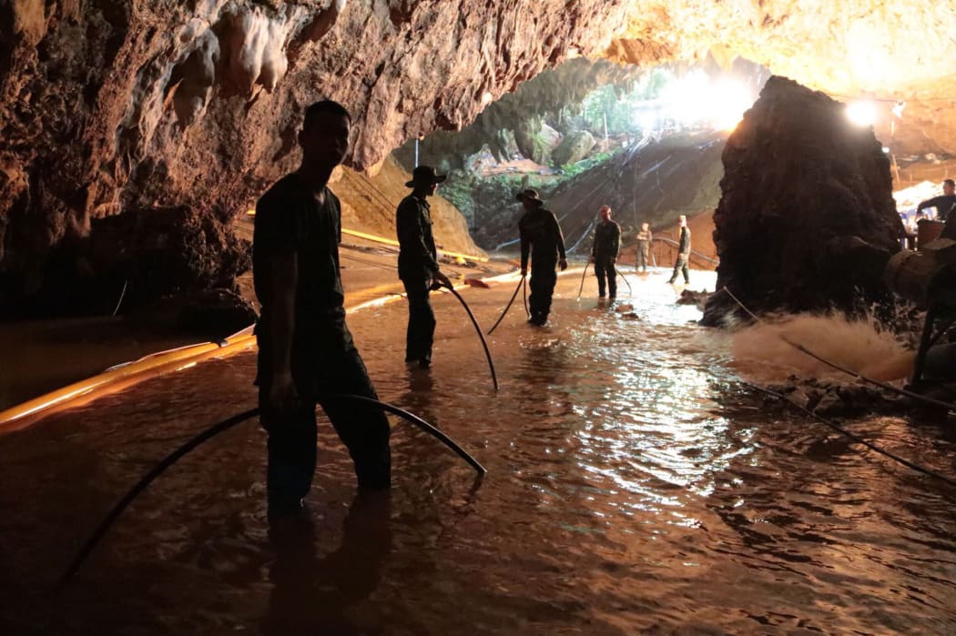 Thai Navy soldiers in the flooded Tham Luang cave during rescue operations for the 12 boys and their football team coach trapped in the cave at Khun Nam Nang Non Forest Park.