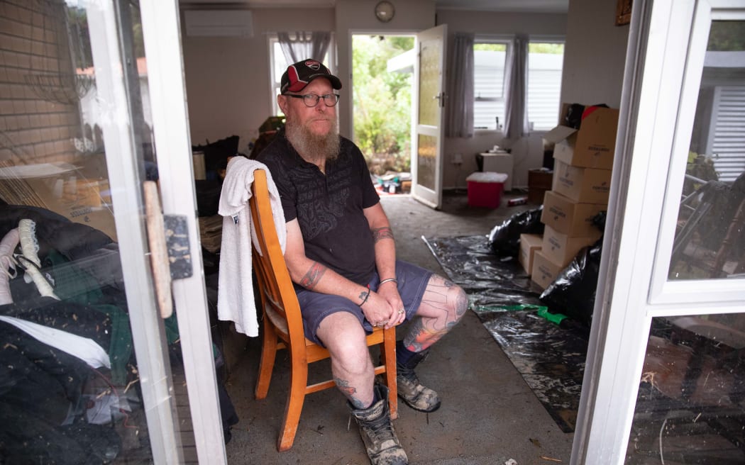 Residents on Comphora Place in West Auckland's Ranui are picking up the pieces at their homes after Momutu Stream overflowed and flooded their properties. Mark Griffin (pictured) says it's the second time it's flooded in 18 months.