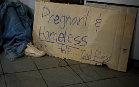 'Pregnant and Homeless' sign (file photo).