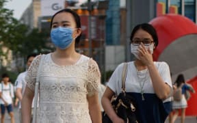 people wearing face masks in Seoul
