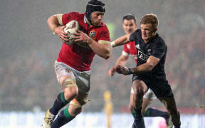 Lions' Sean O'Brien is chased by Damian McKenzie.