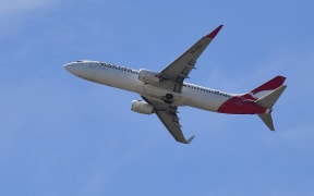 A Qantas Airways plane after taking off from the Sydney Airport in Sydney on March 19, 2020.