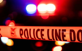 Police tape blocks off a US crime scene.