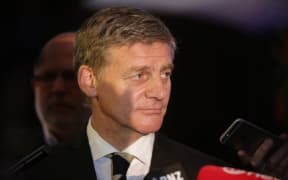 Bill English speaks at a press conference after meeting with Chinese Premier Li Keqiang.