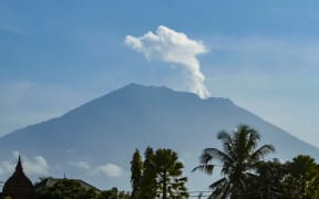Mount Agung volcano spews steam and smoke into the air in October.