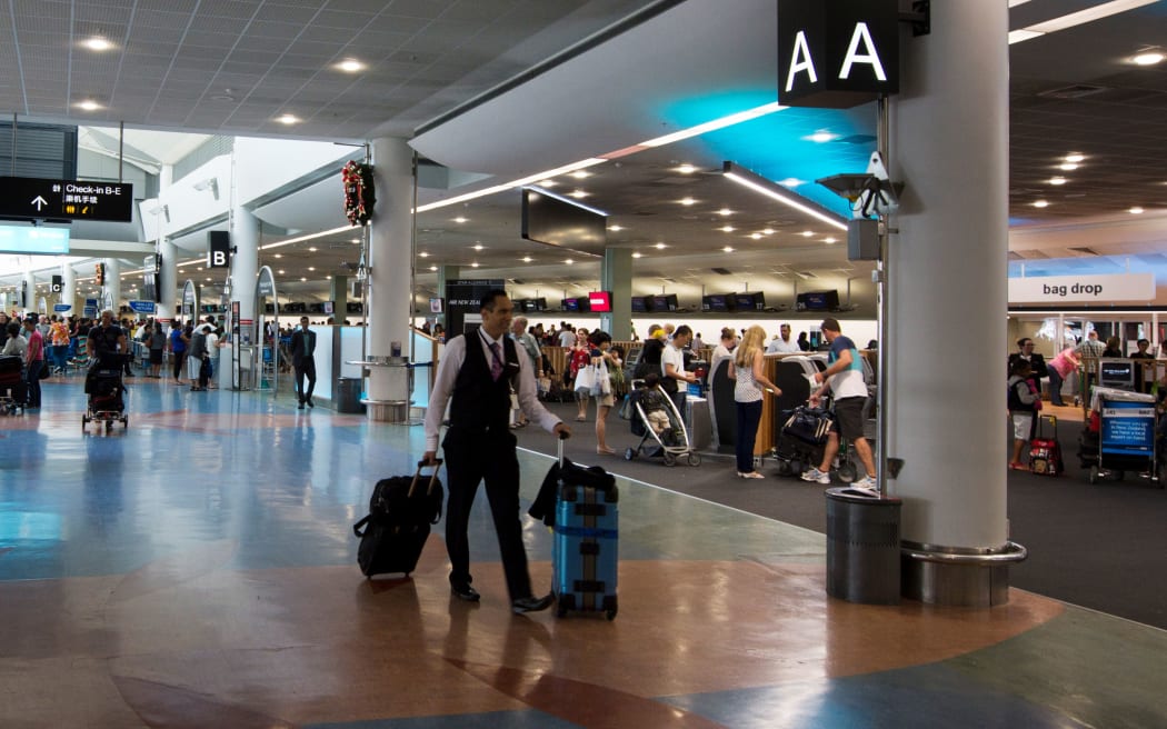 AUCKLAND - DEC 31:Passengers at Auckland Airport on Dec 31 2013.It's the largest and busiest airport in NZ with 14,829,393 passengers in the year ended November 2013.