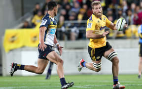 Hurricanes' Brad Shields carries the ball in one hand during the Super Rugby Semi Final, Hurricanes v Brumbies.