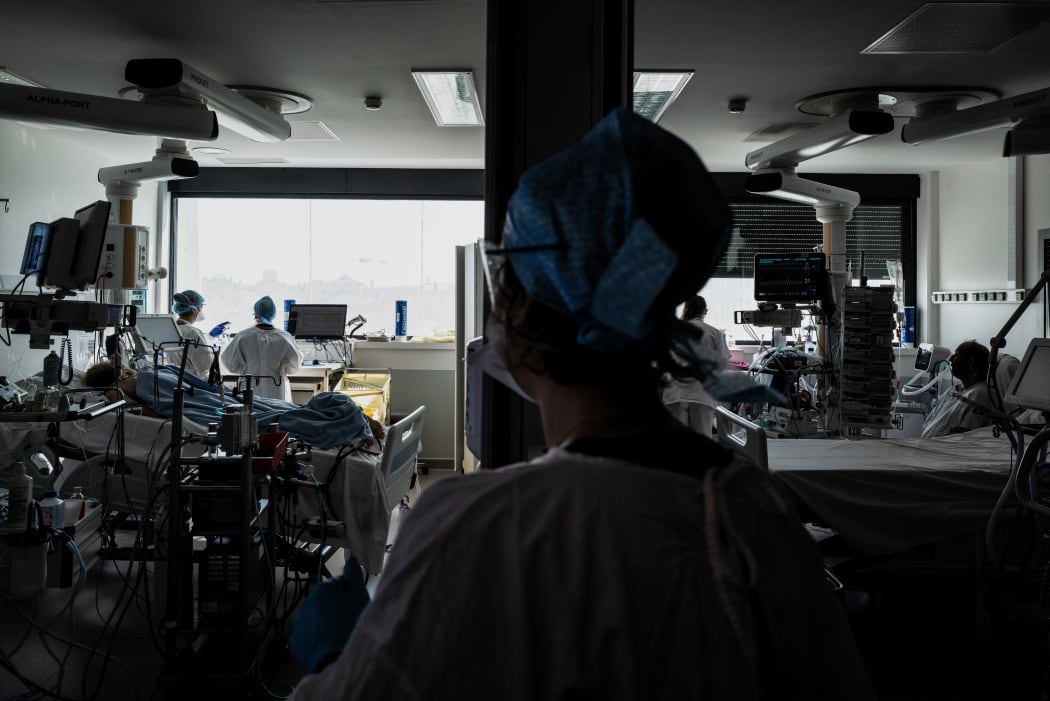 Doctors take care of Covid-19 patients in an intensive care unit of Lyon Croix-Rousse hospital.