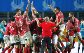 Tonga rugby players celebrate.