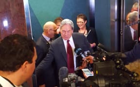 Mr Peters giving a press conference in an elevator.