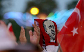 Pro-Erdogan supporters gather in front of the president's residence at Kisikli Neighborhood in Istanbul after the failed coup attempt.