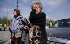 Mother and daughter Dina, right, and Natasha from Mariupol arrive at a centre for displaced people in Zaporizhzhia on 2 May 2022.