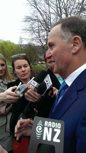 John Key talking to reporters in Christchurch earlier today.