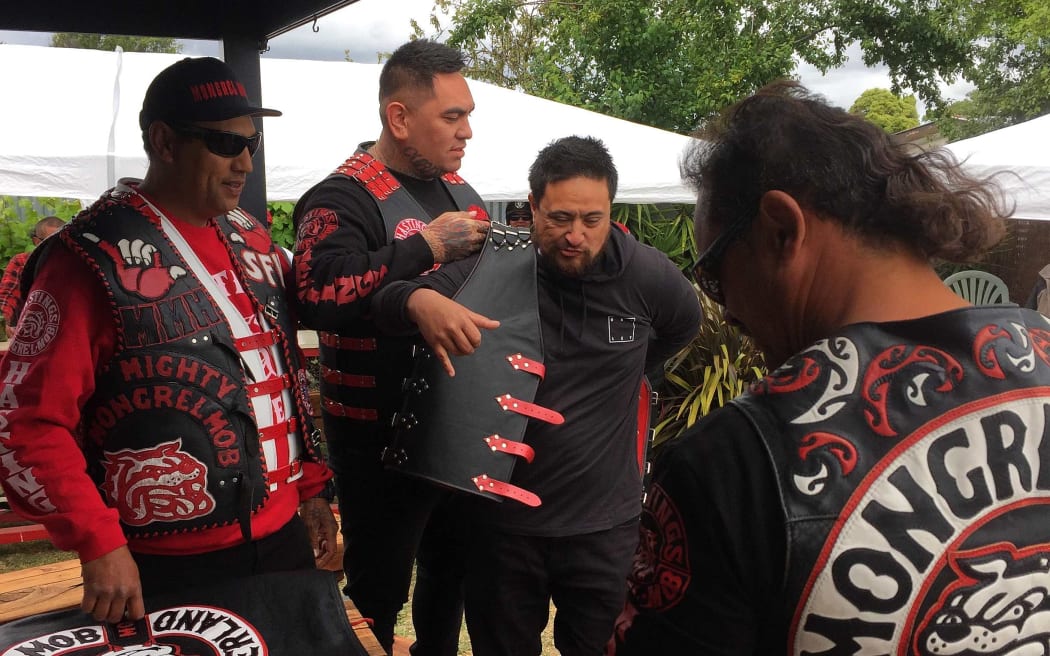 Mongrel mob member puts on patch for the first time.
