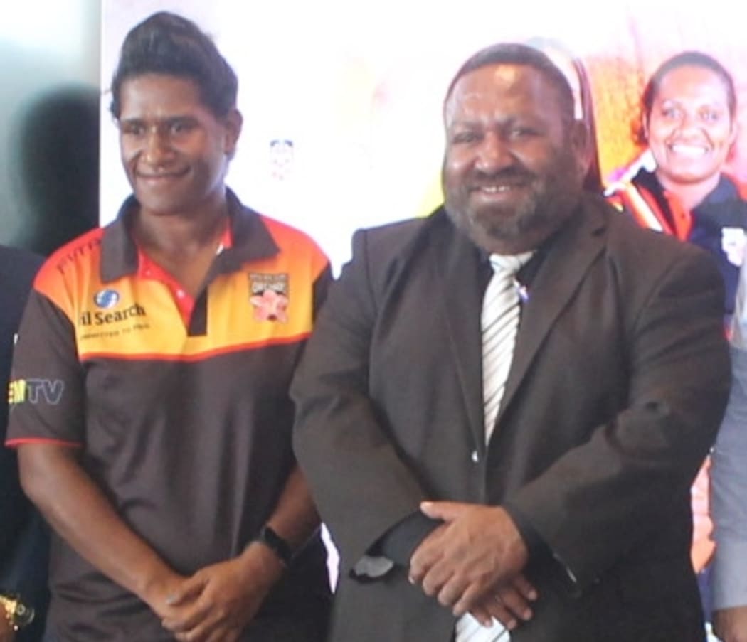 PNG Orchids captain Cathy Neap and PNGRFL Chair Sandis Tsaka.