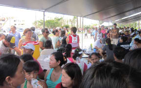 Saipan residents queue for post-typhoon aid at the American Memorial Park, Northern Marianas.