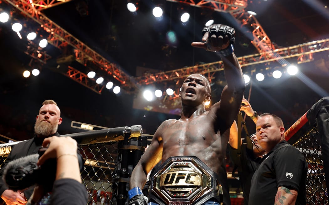 Israel Adesanya celebrates after knocking out Alex Pereira in round 2 to reclaim the middleweight title during UFC 287 at Kaseya Center in Miama.