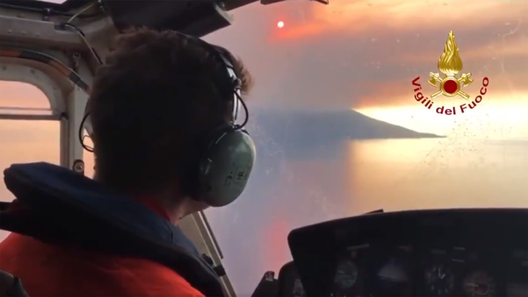 This video grab handout by the Vigili del Fuoco, the Italian National Corps of Firefighters, shows the Stromboli volcano in eruption from a Dragon 59 rescue helicopter on July 3, 2019 above the Stromboli island, north of Sicily.