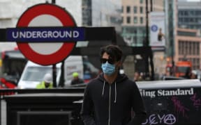 A person wears medical mask as a precaution against coronavirus (COVID-19) in London, United Kingdom on March 18, 2020.