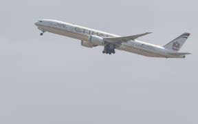 An Etihad Airplane leaves Sydney Airport.