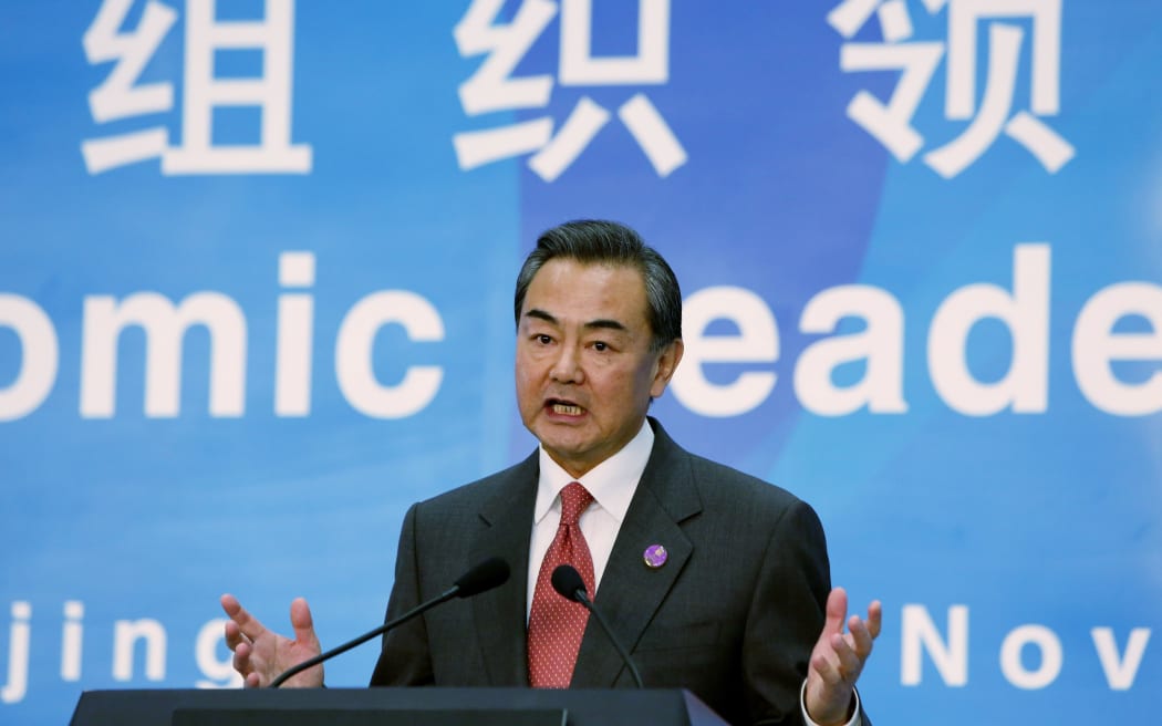 Chinese Foreign Minister Wang Yi speaks at a press conference in Beijing on 8 November.