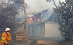Houses alight at the scene of the bushfire in Katoomba.