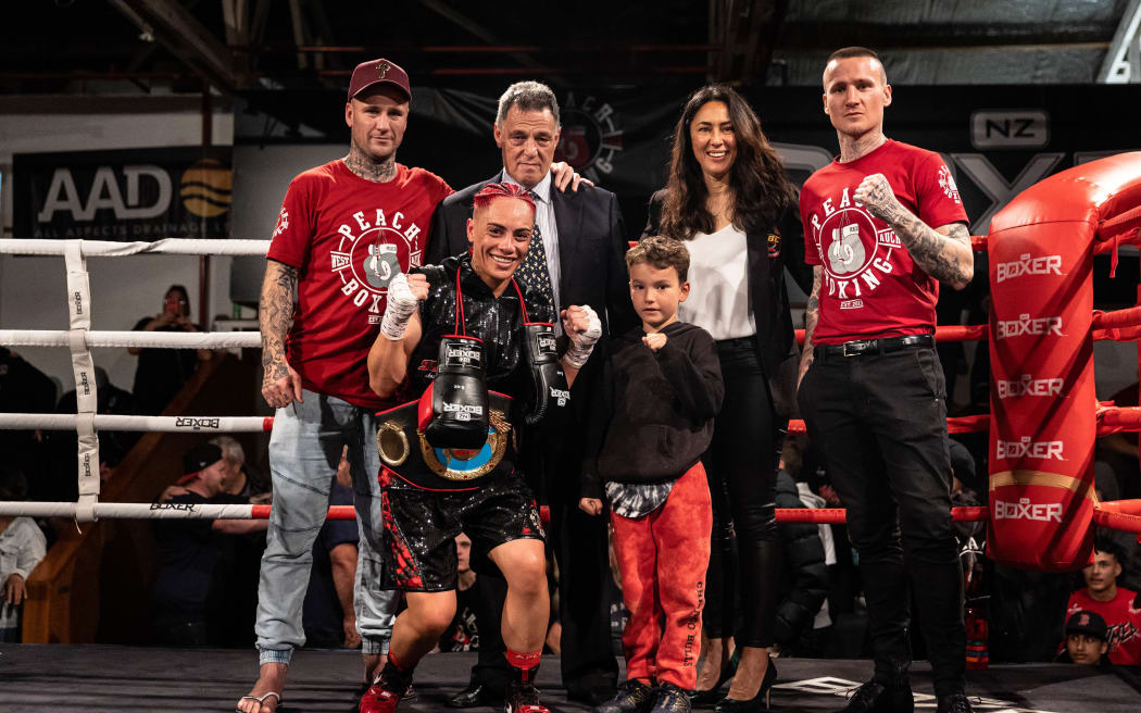 Meya Motu with family and friends after winning the co-main event of Peach Boxing's Pro-Am Fight in February.