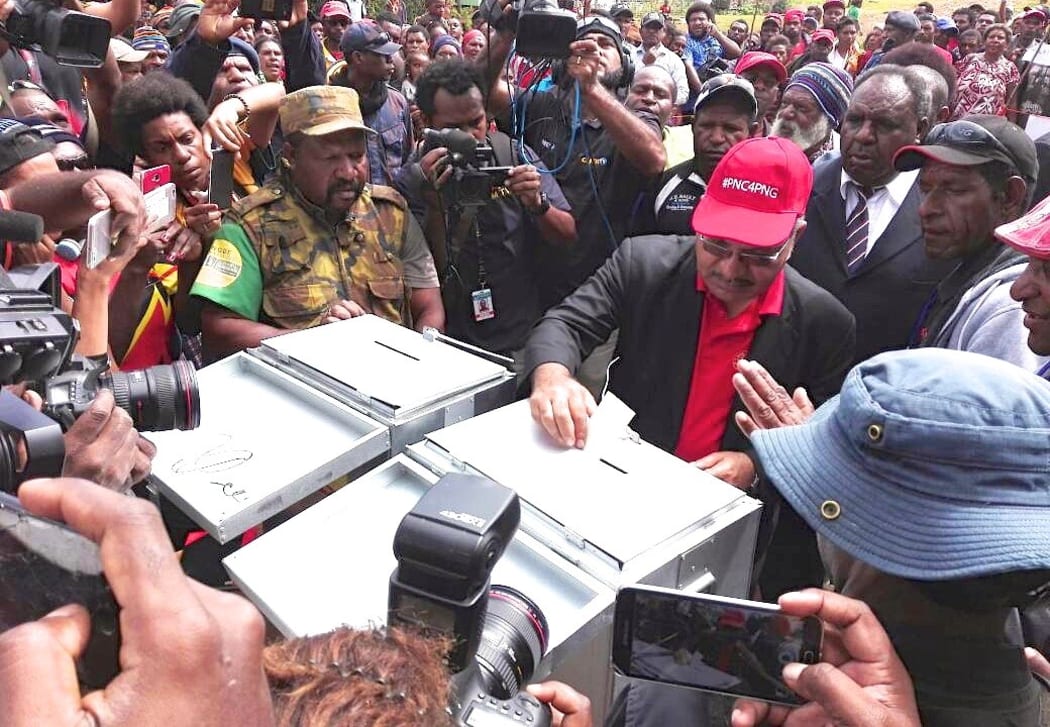 Papua New Guinea prime minister Peter O'Neill casts his vote in the 2017 election in his electorate of Ialibu-Pangia.
