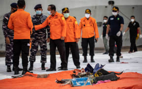 Debris and passengers' items recovered from the crash site of Sriwijaya Air flight SJ182 at the port in Jakarta on January 10, 2021.