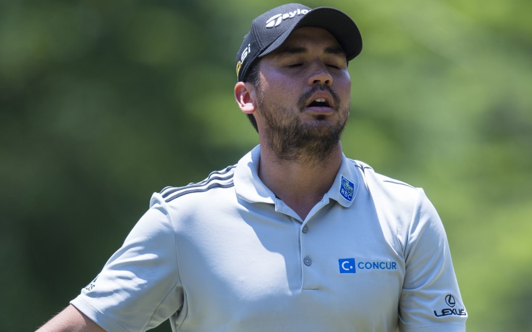 Jason Day reacts to missing a putt.