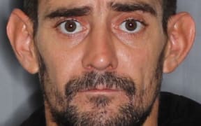 Alan James Harris is wanted over the theft of a number of firearms from the Palmerston North police station.