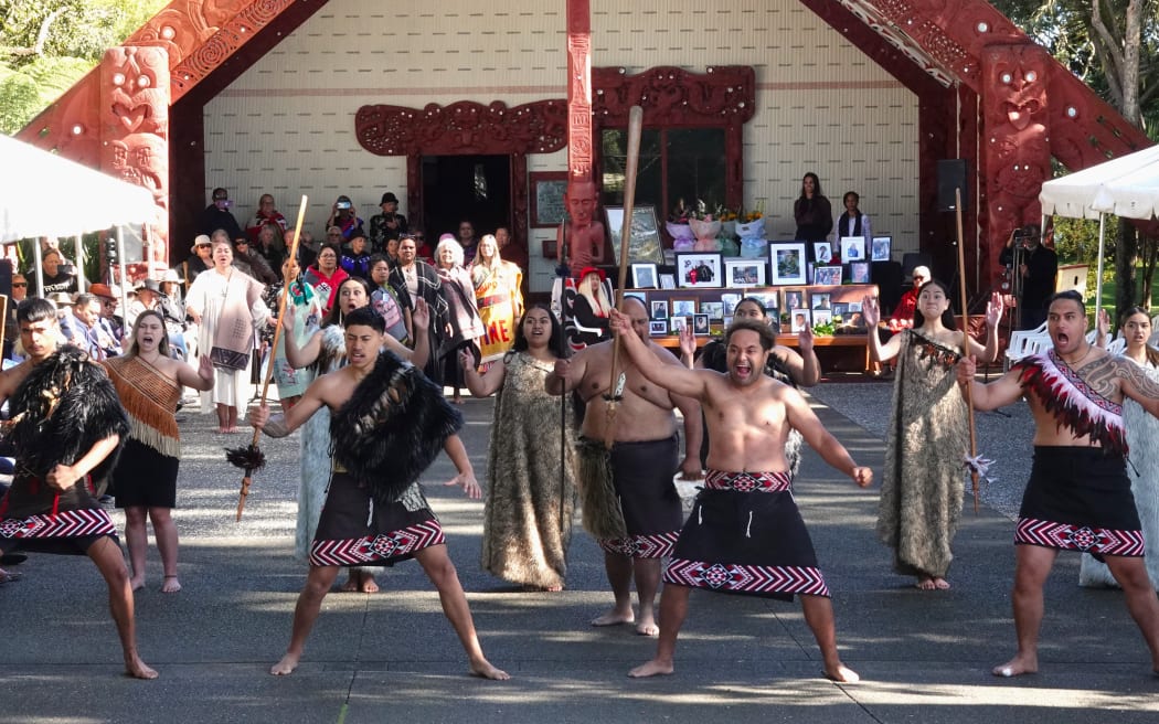 The cultural group Te Pito Whenua performs a haka pōwhiri as members of the Waitangi Tribunal are welcomed onto the Treaty Grounds.