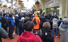 Commuters wait in vain for news at Wellington Railway Station.