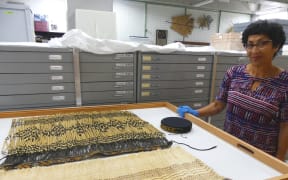 Textile conservator and researcher Rangi Te Kanawa at Te Papa archives.