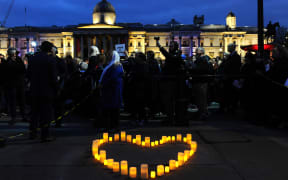 Members of the London New Zealand community and well-wishers attend a vigil at Trafalgar Square in central London on March 21, 2019 in honour of the victims of the Christchurch mosque attacks.