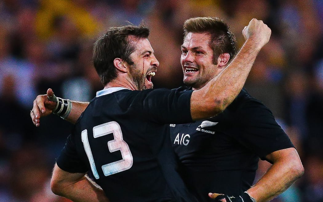 Conrad Smith embraces New Zealand captain Richie McCaw to celebrate the All Black's last minute victory over the Wallabies.