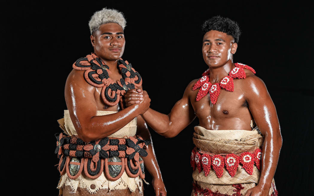 A photo of Lotu Inisi and Fine Inisi clasping hands and wearing traditional Tongan taʻovala.
Moana Pasifika rugby squad commercial day at Mt. Smart Stadium, Auckland, New Zealand on Wednesday 12th January 2022. Super Rugby Pacific rugby competiton.
Mandatory credit: © Andrew Cornaga / www.photosport.nz