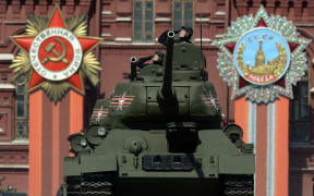 Russian T-34 Soviet-made tanks drive through Red Square during the Victory Day military parade in Moscow.