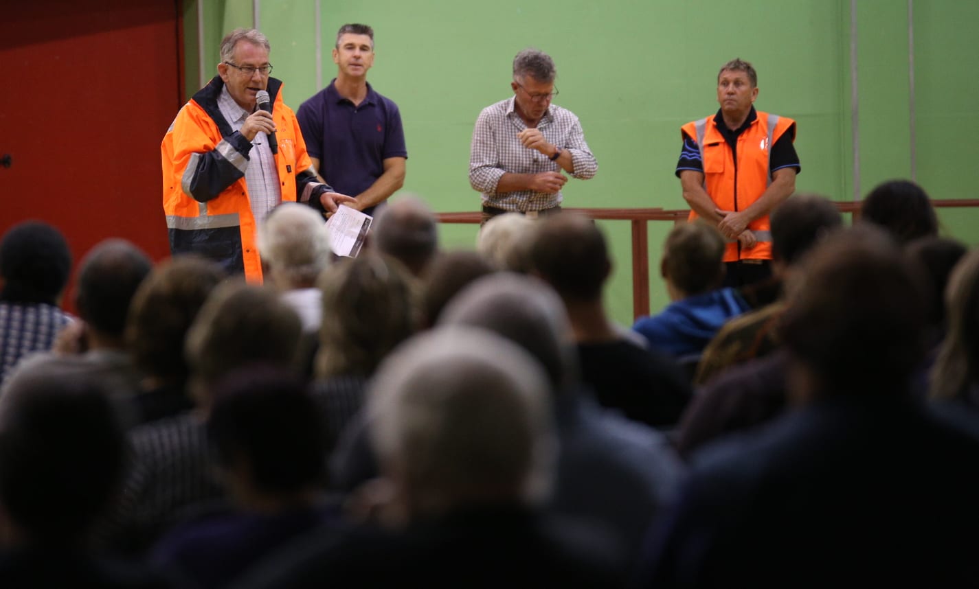 Whakatāne District mayor Tony Bonne speaks at a public meeting of about 500 people after the flooding at Edgecumbe.