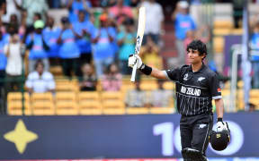 New Zealand's batsman Rachin Ravindra celebrates his century during the ICC Cricket World Cup 2023 match between New Zealand and Pakistan at the M. Chinnaswamy Stadium in Bengaluru.