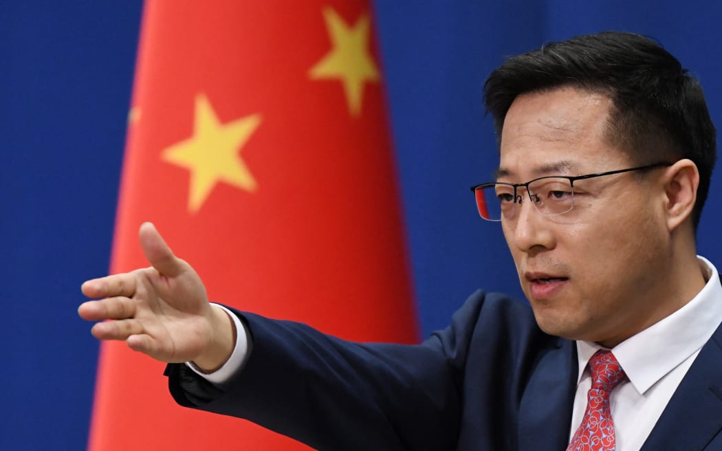 Chinese Foreign Ministry spokesman Zhao Lijian takes a question at the daily media briefing in Beijing on April 8, 2020. (Photo by GREG BAKER / AFP)