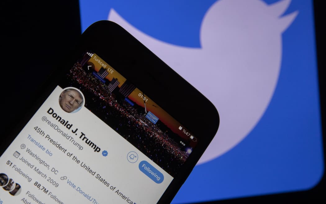 ANKARA, TURKEY - JANUARY 7: In this photo illustration, smart phone screen shows twitter account of U.S. President Donald Trump and a computer screen displaying the logo of Twitter are seen in Ankara, Turkey on January 7, 2021. Ercin Erturk / Anadolu Agency