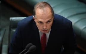Immigration Minister Peter Dutton presents the Australian Citizenship Amendment (Allegiance to Australia) Bill 2015 in the House of Representatives at Parliament in Canberra on 24 June 2015.