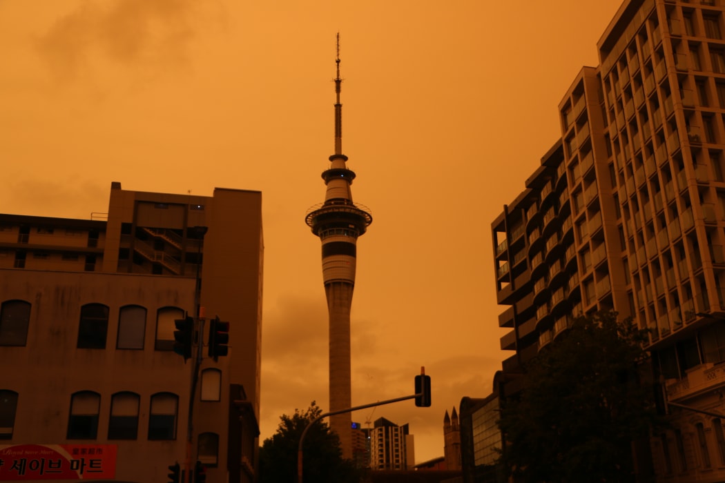 Auckland's Sky Tower in the foreground of a hazy sky from Australia's bushfires.