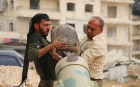 Syrian rebels prepare to fire what a UK-based monitoring group described as "hundreds of missiles".