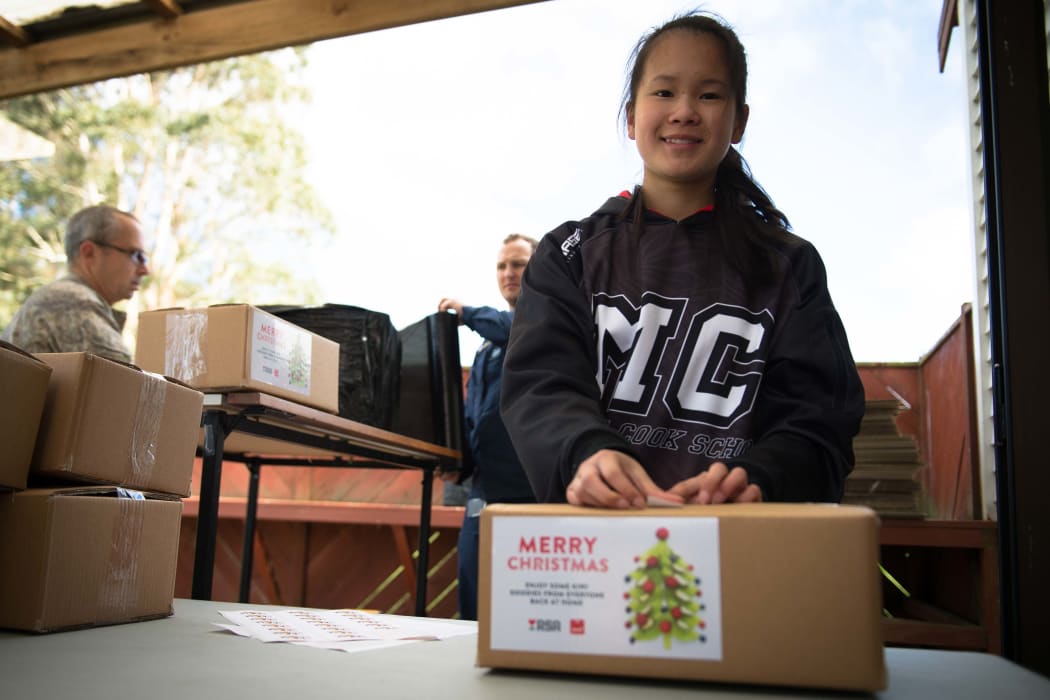 About 40 schoolchildren, veterans, staff from Foodstuffs and Z Energy, and New Zealand Defence Force personnel packed hundreds of Christmas treats this morning for NZDF personnel serving overseas.