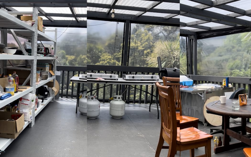 A deck has been converted into a covered makeshift kitchen. The area becomes unbearably hot on a sunny day.