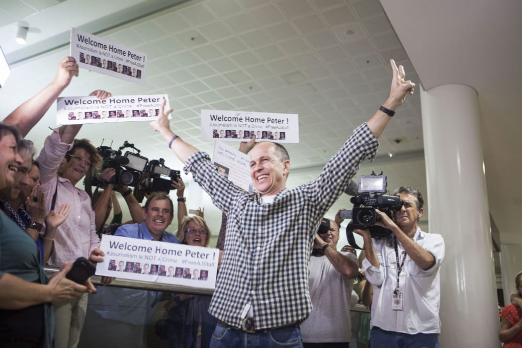 Al Jazeera journalist Peter Greste is warmly greeted by friends, family and media at Brisbane airport on February 5, 2015.