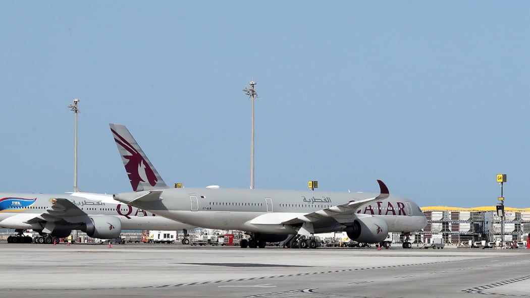 A Qatar Airways Airbus A350-941 aircraft is seen on the tarmac at Hamad International Airport in the Qatari capital Doha.